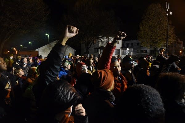 Protesters chant outside the 4th Precinct.