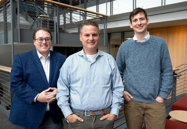 three men posing for a portrait
