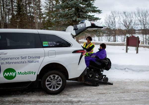 two people get into a vehicle