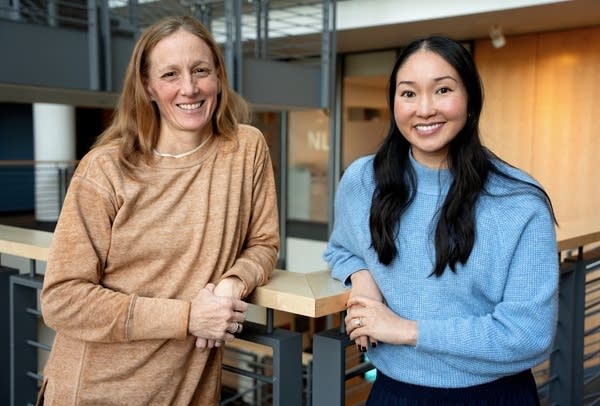 two women posing for a portrait