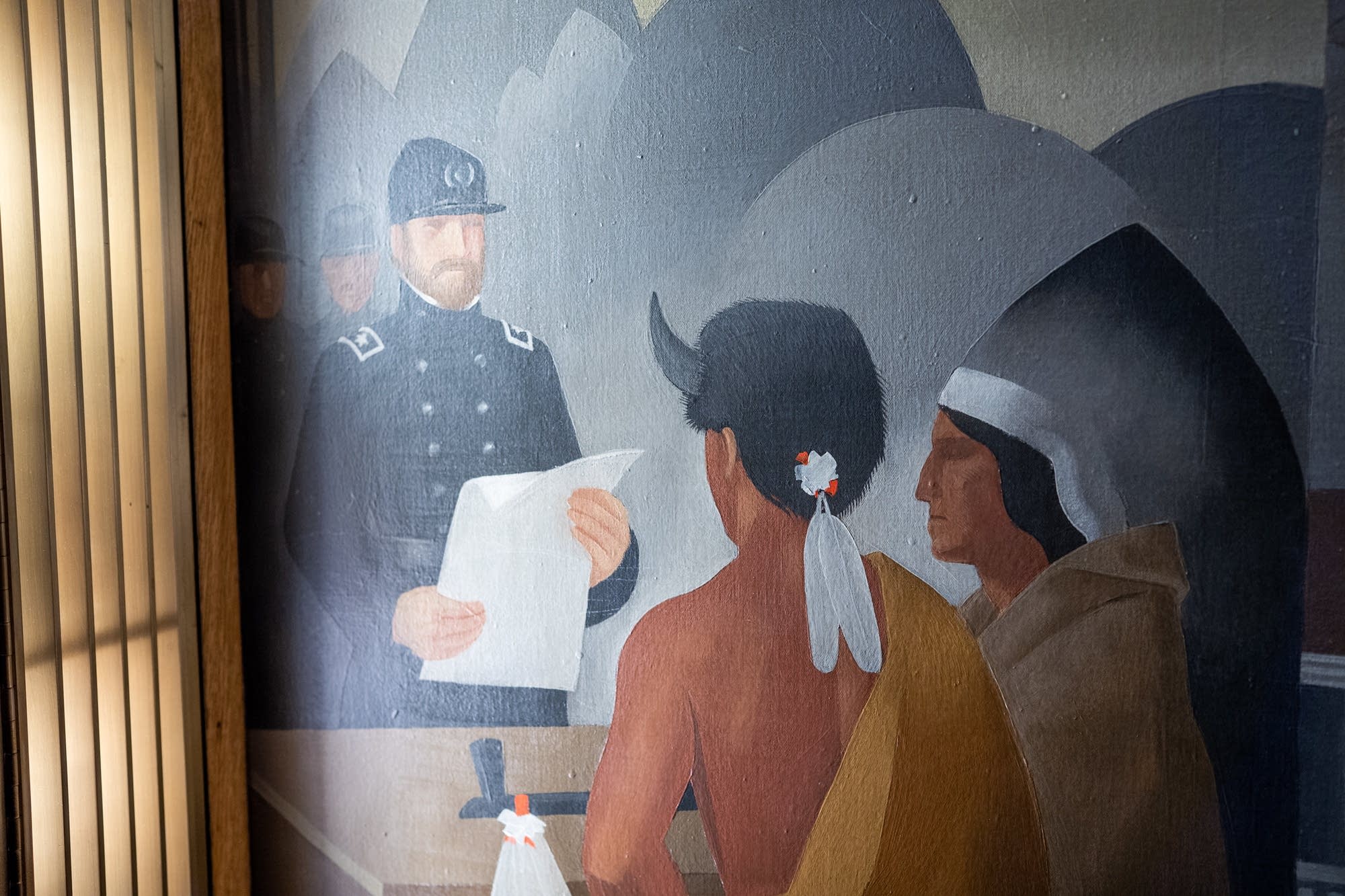 A mural inside the St. Paul City Council chamber depicts Native Americans.