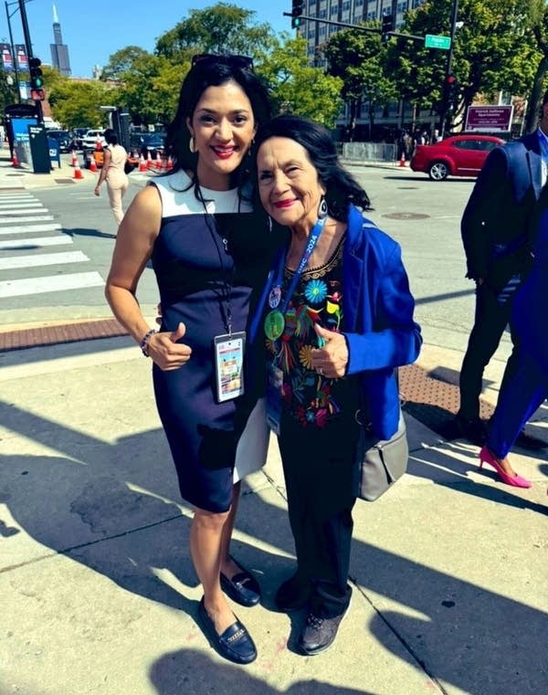 Two people pose for a photograph.