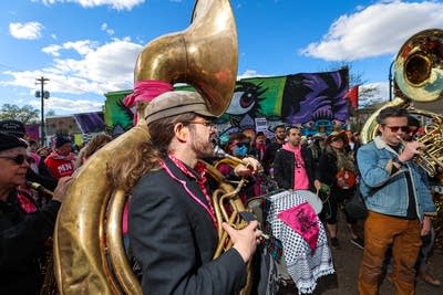 Demonstrators play music during a Workers Day March