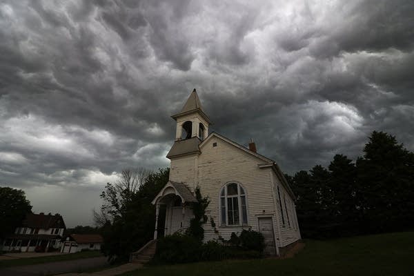 Turbulent storm clouds swirl in the sky above Cleveland, Minn.