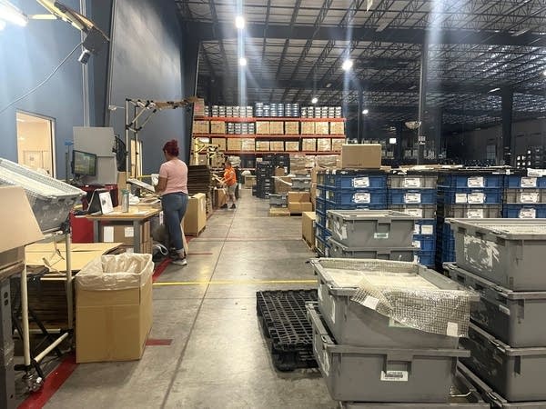 A warehouse with many varied stacks of boxes.