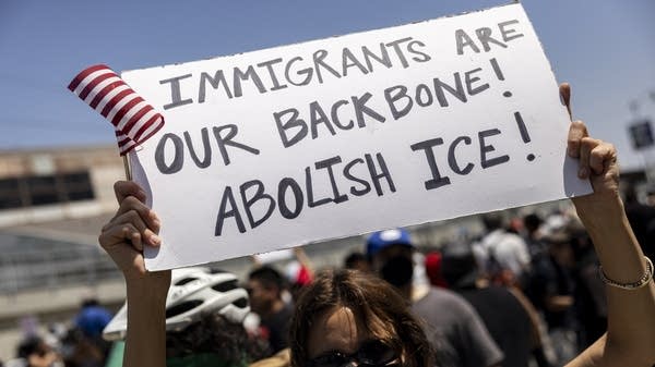 Above, a demonstrator at a protest following federal immigration operations in Los Angeles on Sunday.