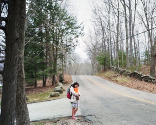 Children wait for their morning bus to school. 