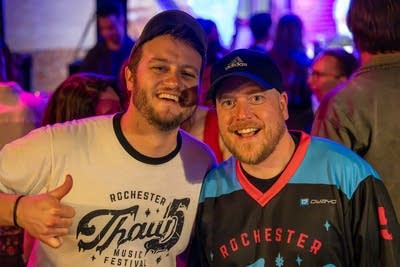 Two guys stand together for a photo