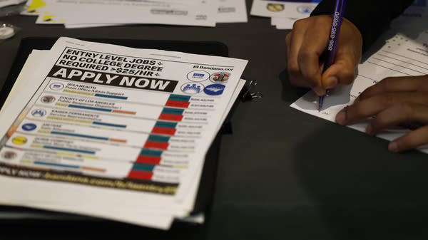 A jobseeker fills out an application.