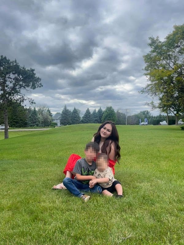 A photo of a woman with children.