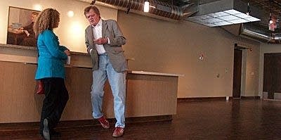 Keillor prepares to sell books (after he learns the till)