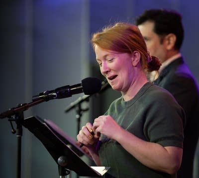 Bridget Bodnar standing infront of a mic and music stand