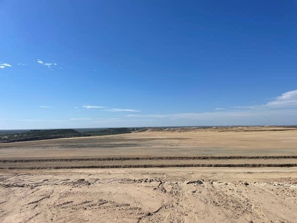 A barren expanse of ranch land.