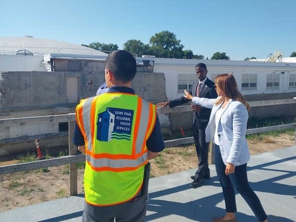 three people taking tour at water treatment plant