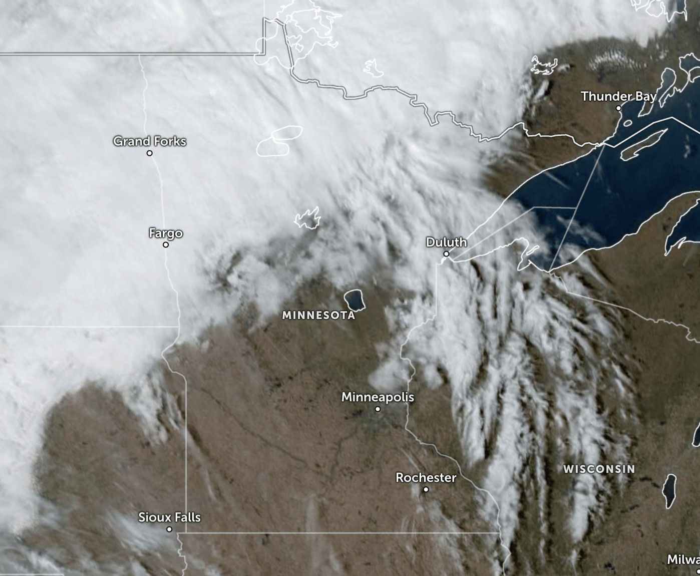 A satellite image of Minnesota shows extensive cloud cover.
