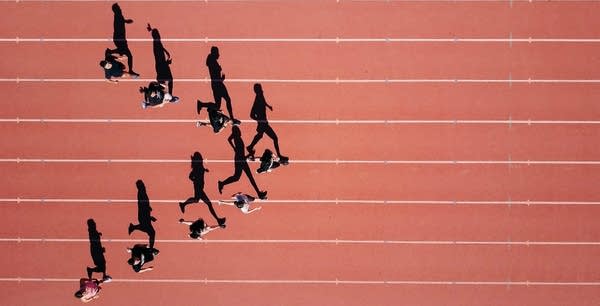 runners casting shadows