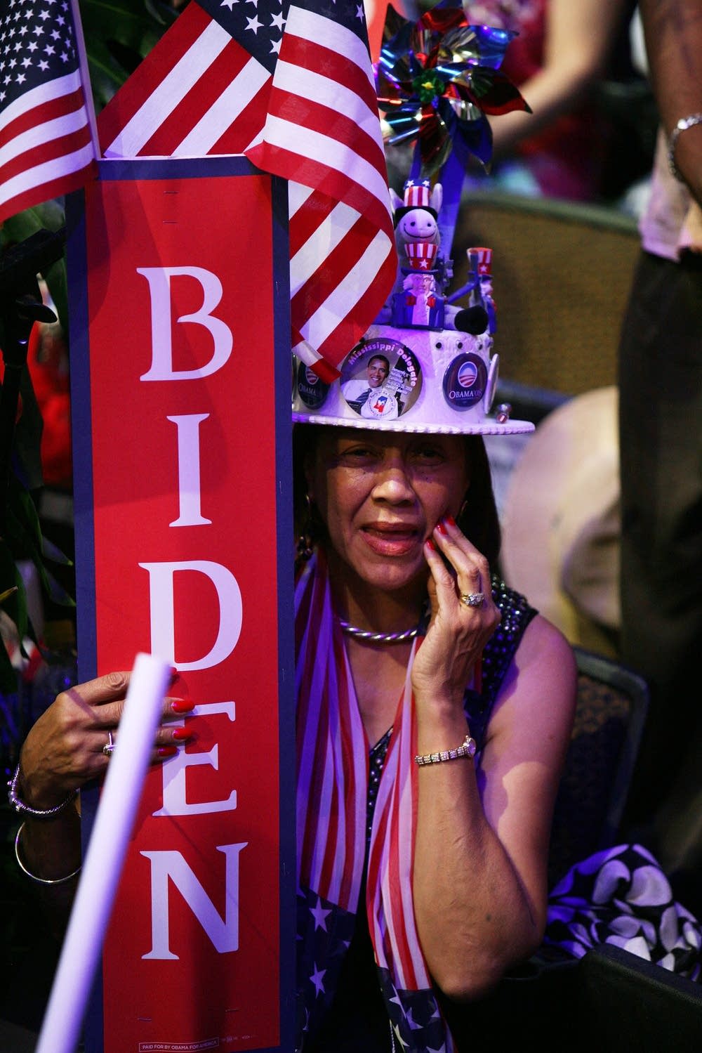 A delegate holds a Biden sign
