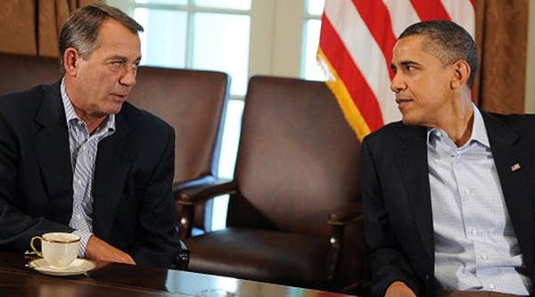 U.S. President Barack Obama speaks with U.S. Speaker of the House John Boehner during a meeting in the Cabinet Room at the White House in Washington, D.C., on July 23, 2011.