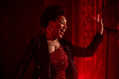 a woman singing on stage 