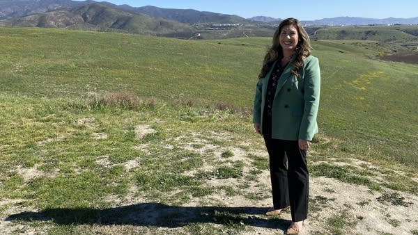Miranda Evans, special projects manager for the city of Chula Vista, stands on the site that the city has designated for a university or group of universities.