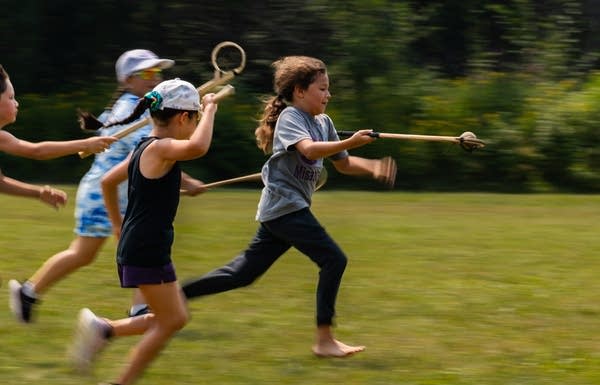 child playing stickball