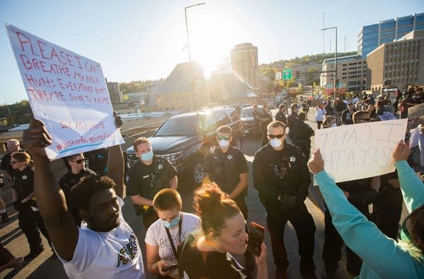 Duluth police officers and protestors meet at the 5th Avenue