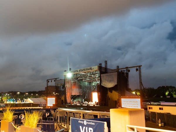A band performs on an outdoor stage
