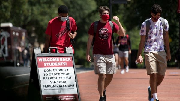 Students walk on campus at the University of South Carolina on Sept. 3. About 80% of private colleges' revenue comes from tuition and student fees — including dorms, dining and parking.
