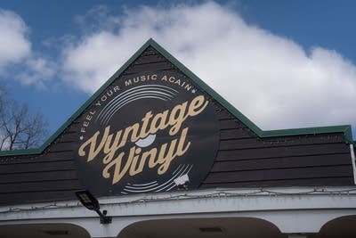 The facade of a commercial building with a business name painted on it