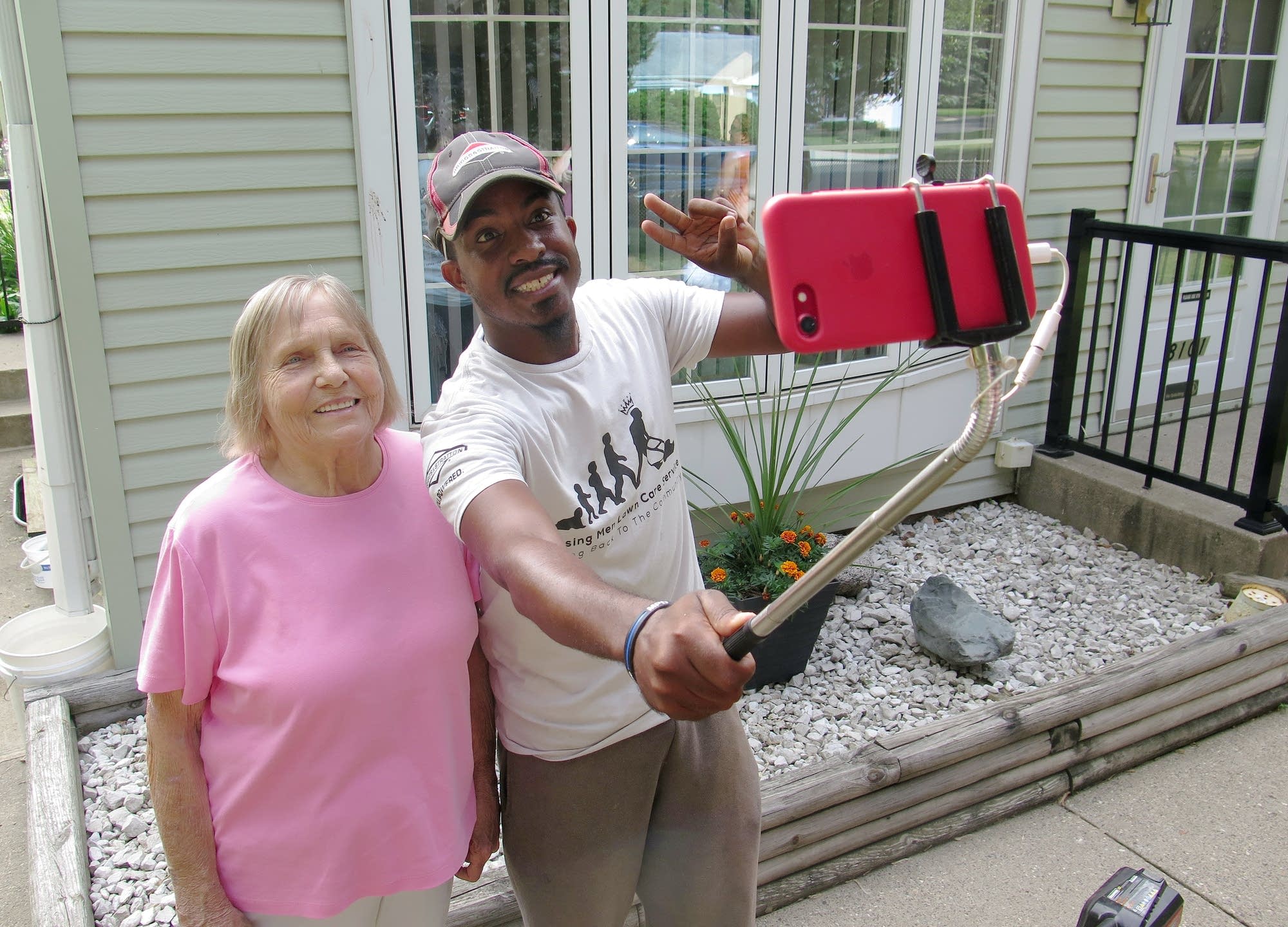 Charlene Frederick-Schrupp posed with Rodney Smith after he mowed her lawn.