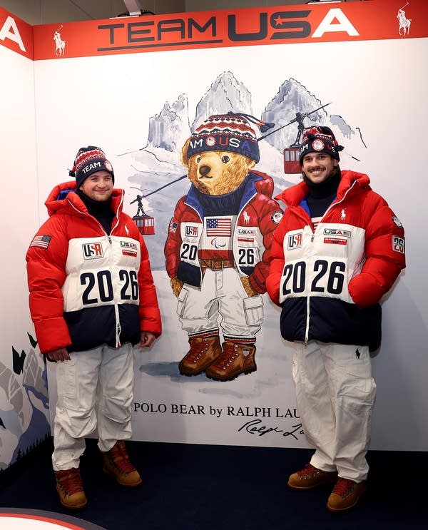 Two athletes pose for a photo.