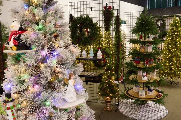 A room full of artificial Christmas trees.