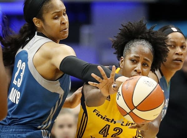 Maya Moore battles Indiana's Shenise Johnson.