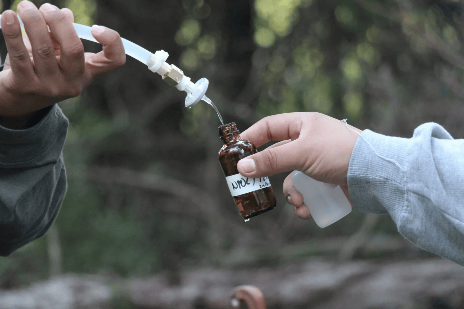 Water being poured into a vial
