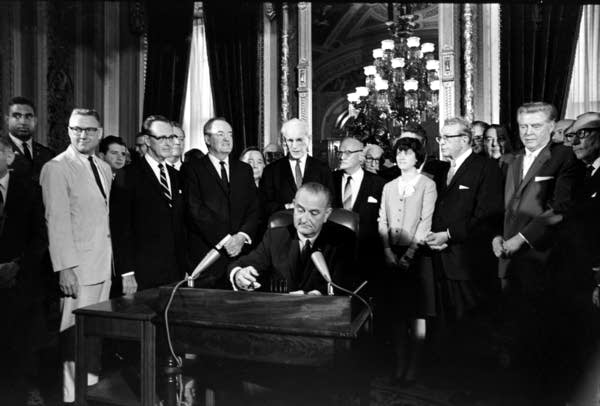 LBJ signs Voting Rights Act