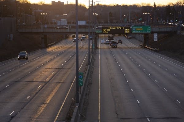 Few cars on an interstate. 