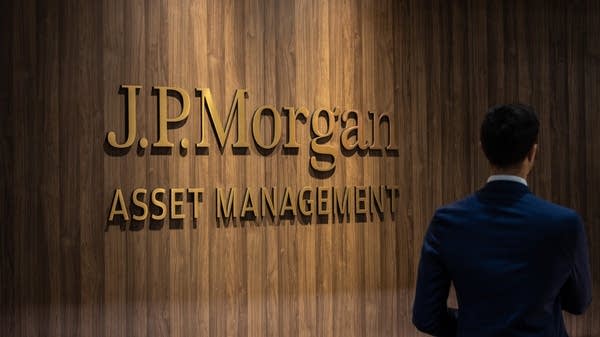 JPMorgan Chase said loan volumes on its cards are up over the last year, a trend driven by strong consumer spending.