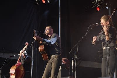 wild horses band playing on an outdoor stage
