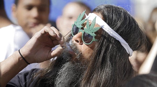 Fast Eddy Aki'a of Hawaii smokes a joint as thousands gathered to celebrate the state's medicinal marijuana laws and collectively light up at 4:20 p.m. in Civic Center Park April 20, 2012 in Denver, Colorado.