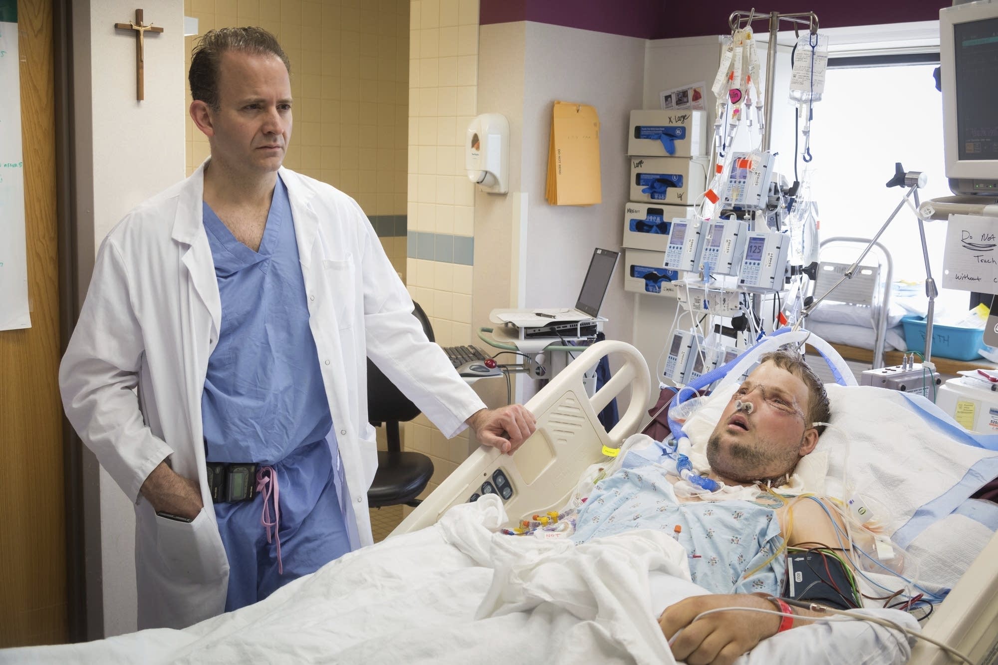 Dr. Samir Mardini checks on Andy Sandness