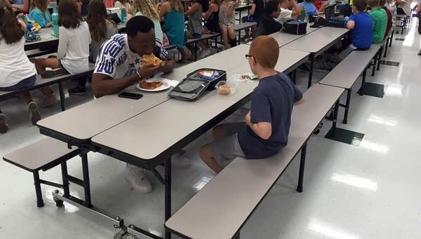 When a football player noticed a kid eating lunch alone