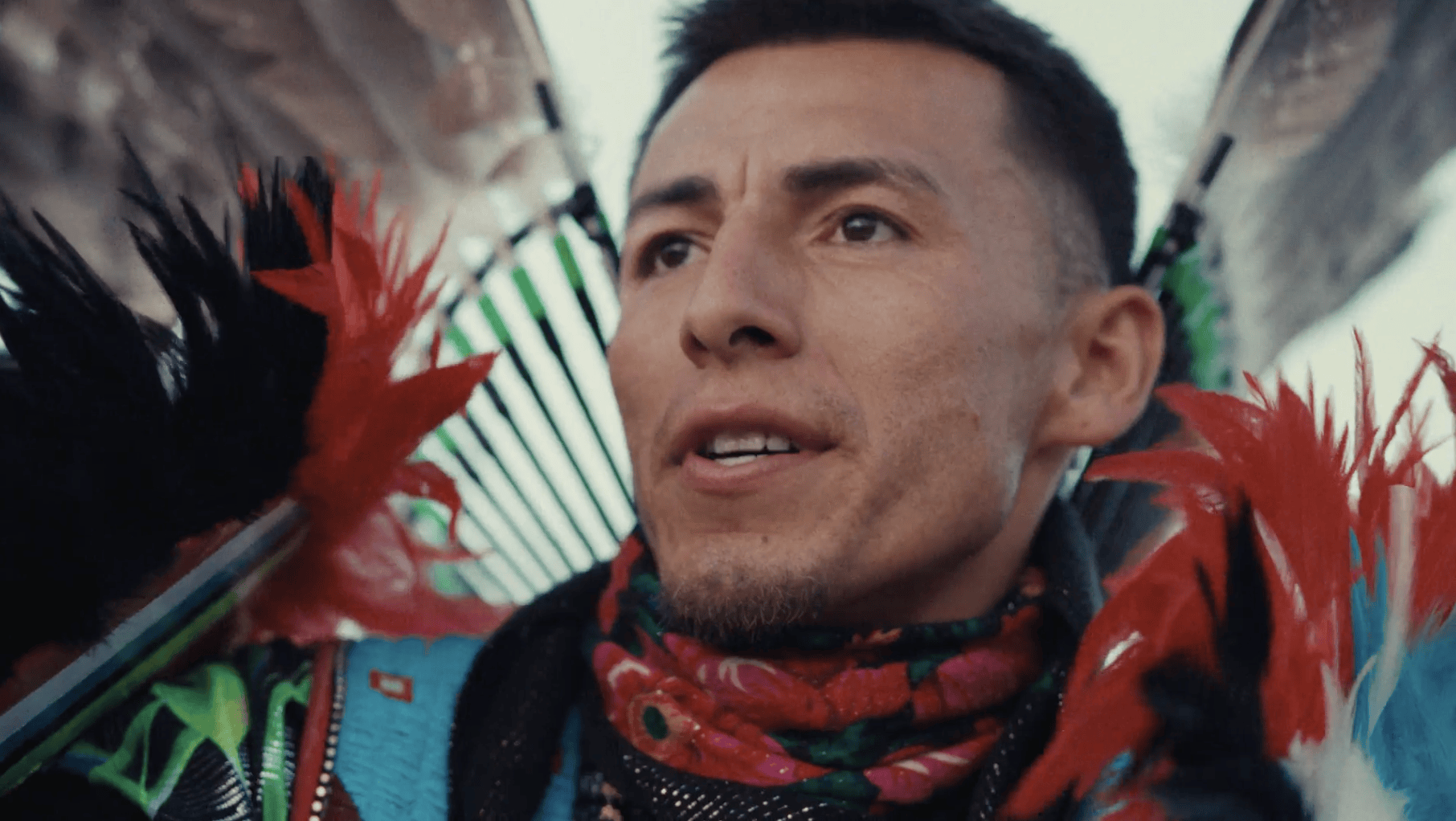 A person with feathers on their neck
