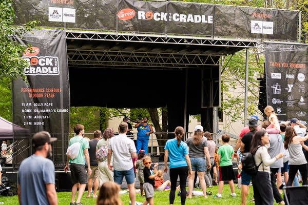 children and their parents enjoying the current's rock the cradle