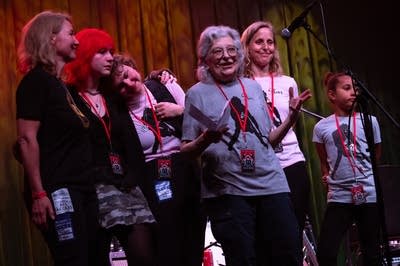 A group of people wearing lanyards.