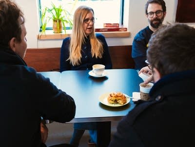 Heights Coffee Bar is a brightly lit shop hosting customers at tables in Columbia Heights, Minnesota.