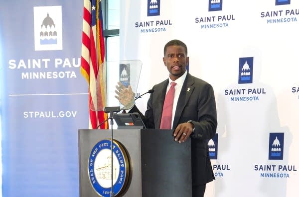 A man speaks at a podium