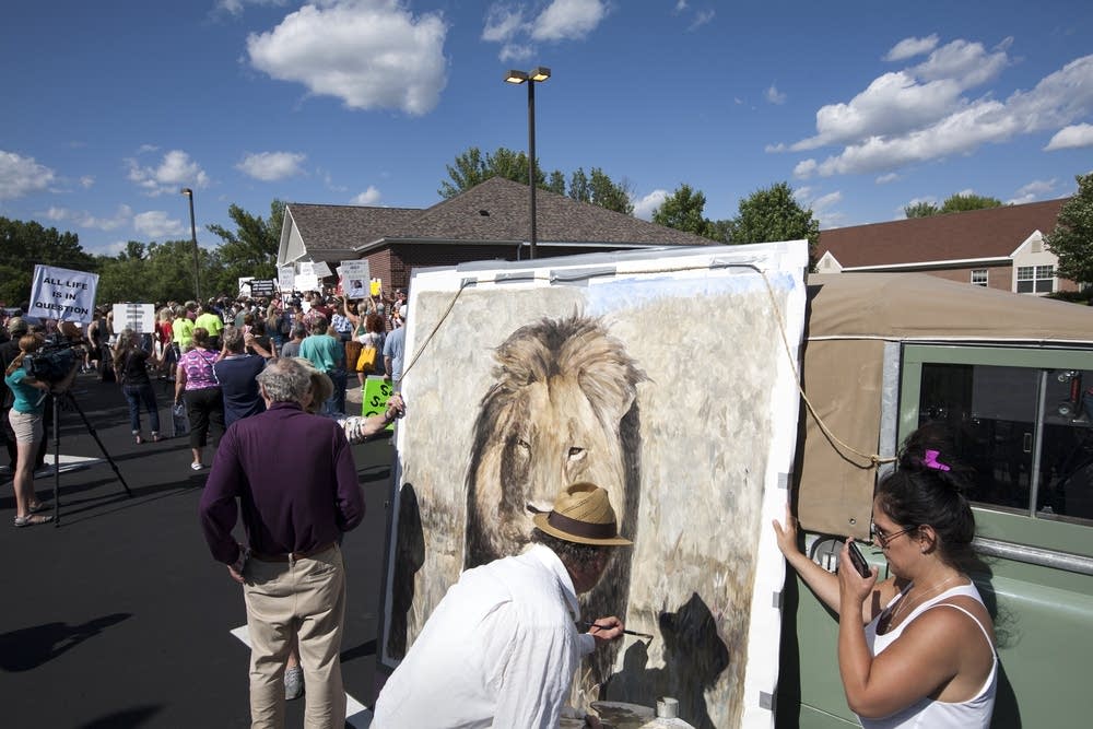 Artist Mark Balma painted during the protest.