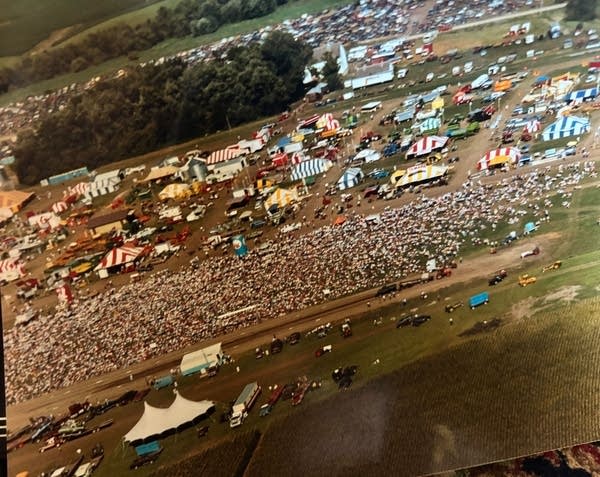 An aerial view of a festival in an older photograph.