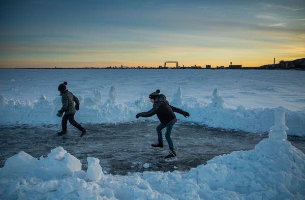 Ansel Cazier skates on Lake Superior with his friend George Belmore.