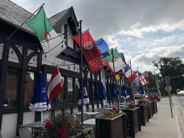Flags for countries playing in the World Cup fly outside a bar in Kansas City.